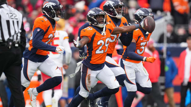 Denver Broncos cornerback Ja'Quan McMillian (29) celebrates his interception in the second quarter against the Kansas City Chiefs at Empower Field at Mile High.